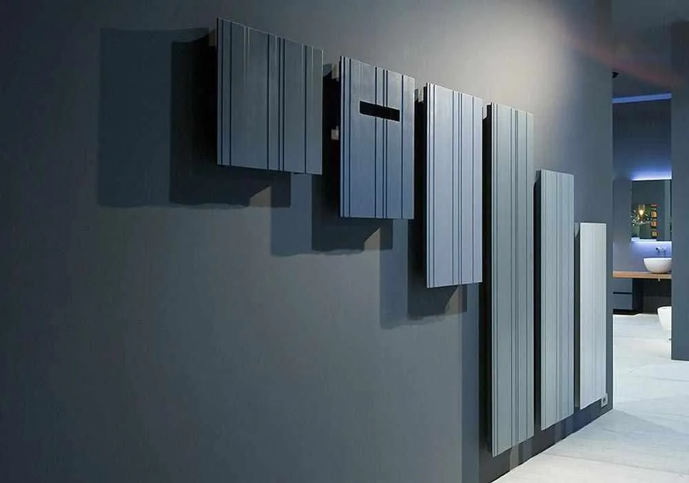Display wall of dark electric radiators in a showroom